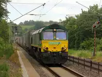 Die Class 66 266 024-9 von Railtraxx  kommt mit Viel Dieselpower mit einem Containerzug aus Köln-Eifeltor(D) nach Genk-Haven(B) und kommt aus Köln-Süd,Köln-West,Köln-Ehrenfeld,Kerpen,Horrem,Buir,Merzenich,Düren,Langerwehe,Eschweiler-Hbf,Stolberg-Hbf(Rheinland) und fährt durch Aachen-Eilendorf in Richtung Aachen-Rothe-Erde,Aachen-Hbf,Aachen-Schanz,Aachen-West. 
Aufgenommen vom Bahnsteig 1 in Aachen-Eilendorf. 
Bei Sommerwetter am Nachmittag vom 2.7.2019.