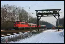 110448 erreicht hier mit dem Regionalzug auf der Fahrt nach Münster am 5.3.2005 den Bahnhof Natrup Hagen.