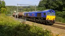 Die Class 66 653-03 von HSL-Belgium kommt aus Richtung Deutschland mit einem Kesselzug aus Ost-Deutschland nach Gent-Zeehaven(B) und kommt aus Richtung Deutschland und fährt durch Gemmenich/Botzelaer(B) in Richtung Montzen(B). 
Aufgenomen bei Gemmenich/Botzelaer(B) von einem Weg an der Montzenroute.
Bei Sommerwetter am Nachmittag vom 25.8.2019.