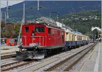 Die HGe 4/4 36 steht mit ihrem Glacier Pullman Express St.Moritz - Zermatt in Brig. Der schöne Zug ist wie folgt formiert: RhB D 4051, RhB As 1144, RhB WR-S 3820 und RhB As 1143.

31. August 2019 