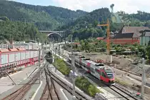 Einfahrt am Nachmittag des 30.06.2018 von ÖBB 4024 084-8 als REX (Brenner/Brennero - Innsbruck Hbf) in den Zielbahnhof, als dieser unterhalb der Bergisel Schanze an der Zfl. vorbei fuhr.