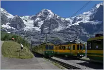 Viel Verkehr auf der Station Wengeneralp, wo sich ein talwärts und zwei bergwärts fahrende WAB Züge kreuzen und dies vor der herrlichen Kulisse der Berge im Hintergrund, wobei in der Mitte wohl der Mönch zu sehen ist.

8. August 2016