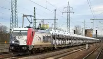 HSL Logistik GmbH, Hamburg [D] mit der EP Cargo Deutschland GmbH Lok  187 086  [NVR-Nummer: 91 80 6187 086-4 D-EPCD) und einem PKW-Transportzug mit fabrikneuen VOLVO PKW-Modellen in Folie eingepackt am 14.01.20 Durchfahrt Bf. Flughafen Berlin Schönefeld. Diese PKW Transportleistung war neu vor Ort, bisher hier noch nie gesichtet.