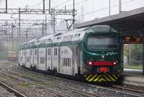 In stromender Regen verlässt TreNord TAF 067 Gallarate am 27 Mai 2019.