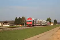 Die GKB 1500.1 schiebt am 10.4.2015 den R8569 mit dem Steuerwagen 86-29 205 an der Spitze Richtung Wies-Eibiswald hier kurz vor dem Bahnhof Frauental-Bad Gams.
