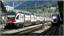 RE3472 nach Zürich mit 511 106 und FV-Dosto RABe502 nach St.Gallen kurz vor Abfahrt in Chur. (02.05.2020)