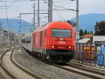 Graz. Am 14.05.2020 fuhr der Regionalexpress von Graz nach Fehring mit geändertem Zuglauf: Mit einer Lok der Reihe 2016 vorraus fährt der Zug hier in den Bahnhof Don Bosco ein. 