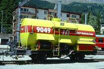 RhB - Xk 9049 II am 20.06.1999 in Davos Platz - Wasserwagen - 2-achsig mit 1 offenen Plattform - Baujahr 1926 - RhB - Gewicht 8,70t - Ladegewicht 15,00t - L�P 7,91 m - zul�ssige Geschwindigkeit 60 km/h - �3=29.05.1998 - Lebenslauf: ex Oz 8101 - 1949 OC� 8101 - 1969 Uh 8101 - 29.05.1998 Xk 8049 II - Hinweis: Logo in deutsch
