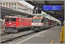 RE1749 mit Ge 6/6 Ii 702  Curia  nach Disentis/Mustér und IR1149 nach St.Moritz mit Ge 4/4 III 641  Naienfeld  in Chur. (14.05.2020)
