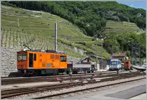 Schon fast ein Zugsuchbild: die TPC HGem 2/2 942 wartet mit dem TPC BVB Xak 917 als Arbeitszug in Aigle Dépôt A-L auf den Gegenzug, der schon von weitem zu sehen ist.

29. Mai 2020