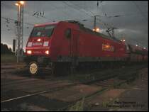 145 038 vor einem PKP Kohlezug aus Richtung Cottbus. diese 145 hatte eine Digitalanzeige wie die Br 146. Warum ist diese bei einer G�terzuglok vorhanden?. Gesehen am 21.07.07 in Falkenberg/Elster vor einem Gewittersturm. 