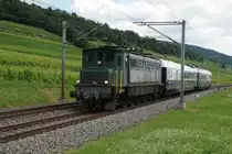 PRESTIGE CONTINENTAL EXPRESS mit der Ae 4/7 10950 von SWISSTRAIN bei Cressier am 11. Juli 2020.
Foto: Walter Ruetsch