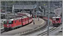 RE1737 mit Ge 4/4 II 631  Untervaz  nach Disentis überholt in Reichenau-Tamins 5737 mit Ge 4/4 I 602  Bernina  nach Ilanz. (23.07.2020)