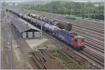 Die mittlerweile  berühmte  Schnauz Re 6/6 11626 (Re 620 026-5)  Zollikofen  wartet in Lausanne Triage auf die Abfahrt in Richtung Yverdon, die erst in westlicher Richtung via  Kehrschleife  erfolgt.

2. Sept. 2020