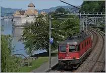 Bildfüllend zeigt sich das Château de Chillon und die nummernletzte SBB Re 6/6 11689 (Re 620 089-3)  Gerra Gambarogno  am Genfersee.  

8. Mai 2020