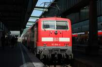 111 058-4 stand am 26.07.07 mit einem Doppelstockzug im Stuttgarter HBF.