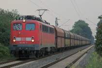 Elok 139 310-7 (BR 139 ist eine Variante der BR 140 mit elektrischer Widerstandsbremse) am 02.08.2007 in Castrop-Rauxel am Bahn�bergang Beckumer Stra�e unterwegs mit einem gemischten Kohlenwagenzug. Es sind �berwiegend gelb/blaue Wagen aus Polen eingereiht.  
