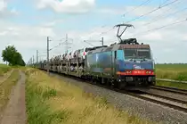 185 601 der HSL schleppte am 13.06.21 einen mit Toyotas beladenen BLG-Autozug durch Braschwitz Richtung Halle(S).