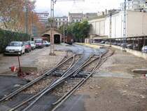 Mallorca/Palma,04.01.06,Einfahrt in den Bf.Palma,im linken,oberen Bildteil ist der zweist�ndige Fahrzeugschuppen zu erkennen,dort ist heute eine Kunstausstellung untergebracht.