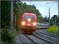 Taurus 1116 048 mit Zug EC 30 Allegro Johann Strau� f�hrt durch den Murwald bei Zeltweg.
17.08.2007