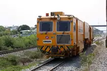 UNIQ Kontinuierliche 2-Schwellen Stopfmaschine 01 (Hersteller: Plasser & Theurer, Type MTT 08-2X-32S, Baujahr: ????, Fab.Nr.: ???) am 30.März 2023 in der Ban Mi Station.