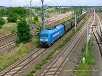 253 014 der PRESS zieht am 05.07.08 einen leeren Holzhackschnitzelzug durch Bitterfeld Richtung Leipzig/Halle. Zum Zeitpunkt der Aufnahme fuhr sie f�r Regental Cargo.