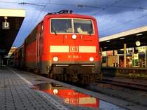 Die 111 168 Pr�sentiert sich im besten Licht nach einem heftigen Gewitter, die dunklen Wolken sind im Hintergrund noch zu erkennen am 08.08.2008 in Passau Hbf. 