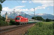 1116 045 bringt den IC 84  Michelangelo , Rimini - M�nchen Hbf (bis Brenner als IC 35184 unterwegs), vom Brenner nach M�nchen und wird beim Kloster Raisach auf den Chip gebannt. (05.07.2008)
