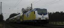 146 534-3 bei der Einfahrt mit MEr 36513 Hamburg-Harburg - L�neburg in Radbruch am 31.01.09.