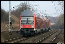 S2 aus Warnem�nde nach G�strow. Aufgenommen habe ich das Bild am 05.03.09 mit etwas Tele in Papendorf.Geschoben hat die 143 224.