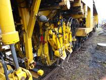 Die Werkzeuge einer Stopfmaschine vom Typ 08-475 Unimat 4S von Plasser & Theurer.
