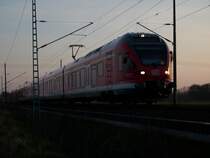 Flirt 429 als RE 33317 Stralsund-Binz am 09.April 2009 auf freier Strecke vor Bergen/R�gen.