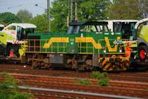 Von der Dortmunder Eisenbahn erwischte ich am 23.04.2009 die Lok Nr. 401. Eine Gr�n-Gelb lackierte MaK G1206, die hier in G�tersloh auf dem HBf eine G�terzug mit fabrikneuen Claas-M�hdreschern und Landmaschinen zusammen stellt. 