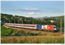 1116.003 (EM-Frankreich) mit dem OEC764 auf der Reise von Wien nach Innsbruck. D�rrwien, 11.07.2009.
