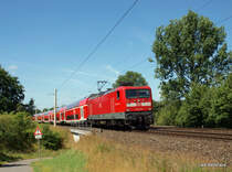 112 179-7 legt sich am 16.07.09 mit dem RE 21414 Hamburg Hbf - L�beck Hbf kurz nach der Ausfahrt aus Bad Oldesloe in eine leichte Rechtskurve, beschleunigt nun auf 140 km/h und wird in 6 Minuten Reinfeld (Holst.) erreichen.