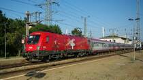 1116 075-1 EM Schweiz mit OIC nach Salzburg am 20.08.2009 beim Halt in Wien H�tteldorf. 