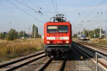 114 009 mit ihrem RE nach Luhterstadt Wittenberg in G�strow links steht OLA 010