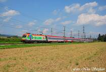 Der Hauptgrund f�r den Tag an der sch�nen Westbahn:SOS-Kinderdorflok 1116 007-4 mit �BB EC 640  Joseph Haydn  Wien Westbahnhof - Salzburg Hbf. inmitten der flachen Felder und Petrus lachte auch noch dazu,Pasching (�sterreichurlaub 18.08.09)