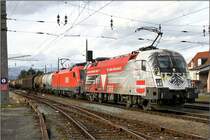 Ein Taurustandem zieht den 54754 von Villach nach Graz.Vorne die 1116 246  Bundesheer  und am Zug 1116 140.
Zeltweg 30.11.2009