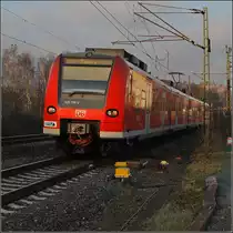 Quitschologie: Einfacher Mittelhessenexpress mit 425 016-3 (Fotostandort ist ein �ffentlicher Parkplatz, Dezember 2009).