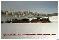 ... w�nsche ich allen Bahnbilder.de Photographen.

Beim Winterdampf im Hausruck fahren die beiden �GEG Dampfloks 657.2770 & 638.1301 mit SDZ R16186 von Simbach nach Attnang-Puchheim. Eberschwang 28.2.2009

