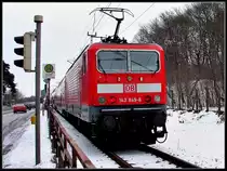 Auf dem Dnholm- Ein Inselchen zwischen Stralsund und der Insel Rgen. 143 849-8 schiebt RE33209 nach Sassnitz.  am 02.03.06 