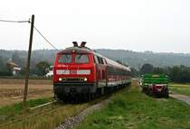 Am 11. September 2009 bef�rdert die Ulmer 218 196 die RB 13495 von Wendlingen bei Brucken  �ber die zugewachsenen Gleise der Teckbahn in Richtung Oberlenningen.