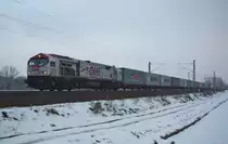 Am Sonntag Abend donnerte der OHE Tiger 330092 mit einem Containerzug in Fahrtrichtung Norden durch Eschwege West. Aufgenommen am 07.02.2010.