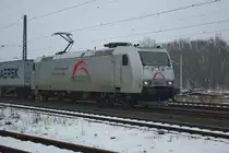 Leider nichts aussergw�hnliches, das den sonnt�glichen TXL-Zug bespannte. So ergibt das Bild mit 185 538-6 bei dem Wetter keinerlei Kontraste. Aufgenommen am 07.02.2010 in Eschwege West.