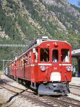 RhB Dampf-Extrazug mit Triebwagenvorspann f�r GRUB�NDEN TOURS 3413 von Pontresina nach Ospizio Bernina am 26.08.2000 in Morteratsch mit Triebwagen und Dampflok ABe 4/4I 34 - ABe 4/4I 30 - G 3/4 1 - Xk 9398 - B� 2060 C� 2012. Hinweis: Triebwagen noch in roter Lackierung!
