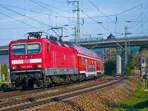 143 134-5 fährt mit einer RB aus Großheringen gleich in den Bahnhof Saalfeld (Saale) ein. (24.04.2010)