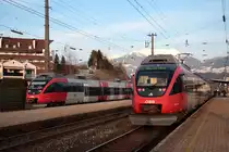 Im Bf Fritzens-Wattens warten 2 Garnituren 4024 auf die Weiterfahrt, rechts 4024 ...+057 als S1 5125 nach W�rgl und links 4024 077 als S2 5166 nach �tztal. (17.03.2010)