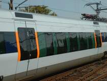 X31 Contessa Mittelwagen am 05.09.2002 im Bahnhof Malm�. Der Niederflurteil hat weiter herabgezogene Fenster, �ber den T�ren ist die Zuglaufanzeige.