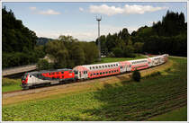 218 256 mit dem R 8419 von Graz nach K�flach am 18.6.2010 in den Kremser Reihen kurz nach der Haltestelle Gaisfeld aufgenommen.